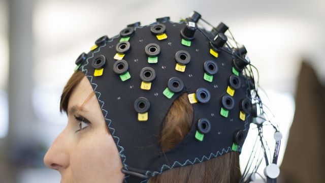 Woman wearing an EEG cap