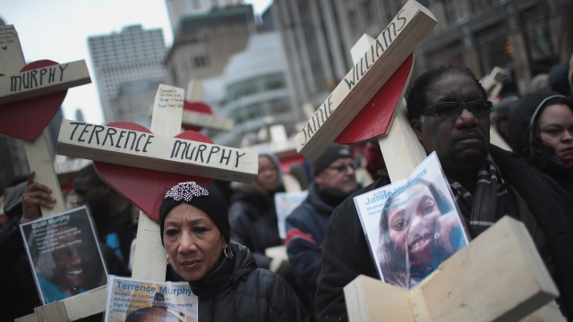 Activists and friends and family members of victims of gun violence march down Michigan Avenue.