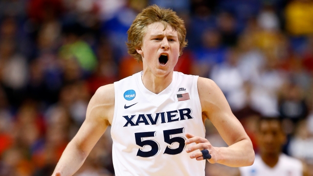JP Macura wears a No. 55 jersey in a March Madness game.