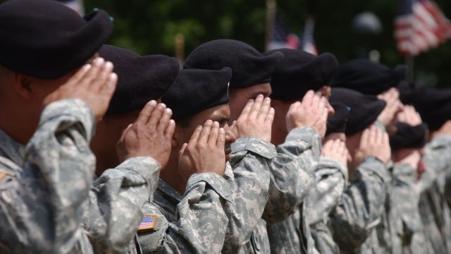 National Guard soldiers stand at attention during a deployment ceremony.