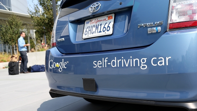 A Google self-driving car is displayed.