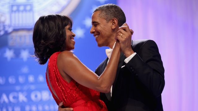 Barack and Michelle Obama dance together.