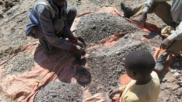 A boy in the Democratic Republic of the Congo sorts stones