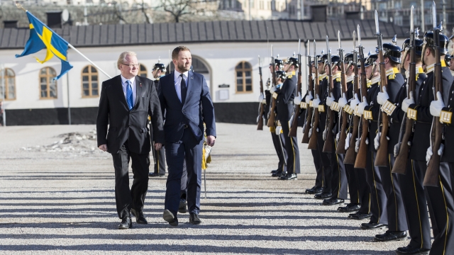 Swedish and Estonian ministers of defense walking together