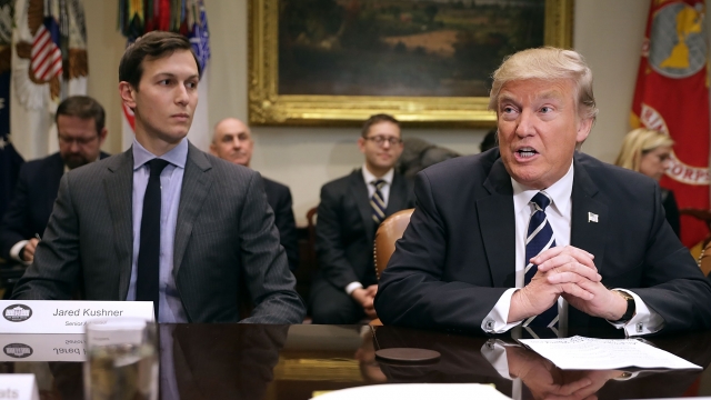 Jared Kushner sits next to President Trump at a meeting.