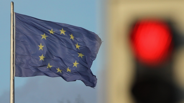 A flag of the European Union waves in the wind.
