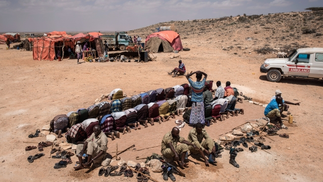 Men pray at camp in Karin Sarmayo, Somalia