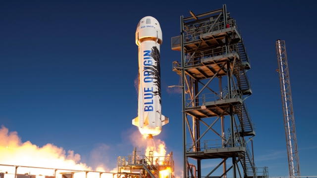 Blue Origin rocket taking off from launch pad