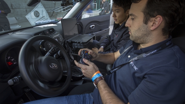 Engineers in an autonomous car