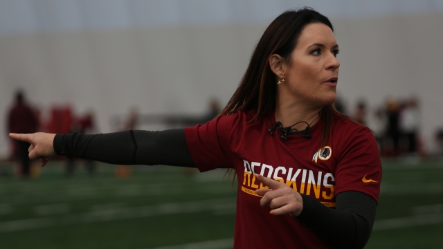 Jen Welter coaches at a football camp.