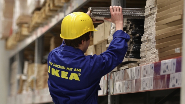 Ikea worker stocks shelf
