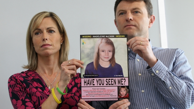Kate and Gerry McCann hold an age-progressed image of Madeleine McCann.