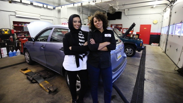 Noor Tagouri and Patrice Banks stand inside the shop at Girls Auto Clinic