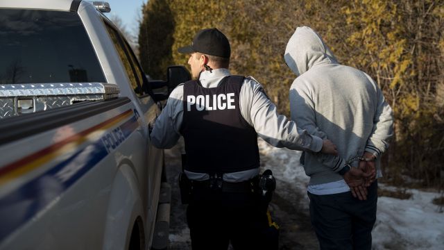 Canadian police arrest a migrant