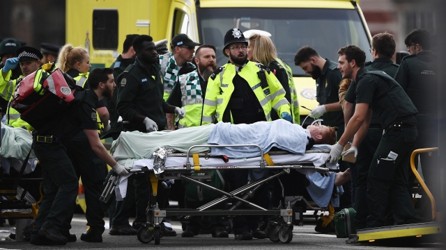 Emergency services treat a victim near Westminster Bridge.