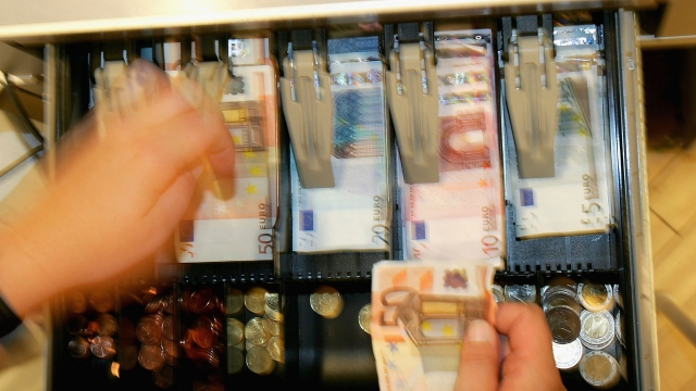 Euro bills in a cash register drawer