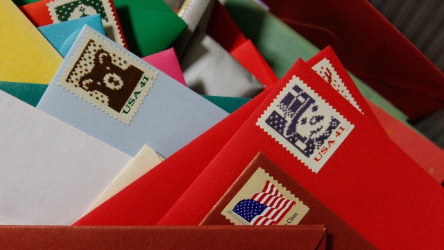 Holiday cards sit in a bin at the U.S. Post Office.