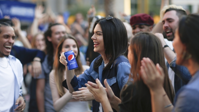 Kendall Jenner holds a can of Pepsi.