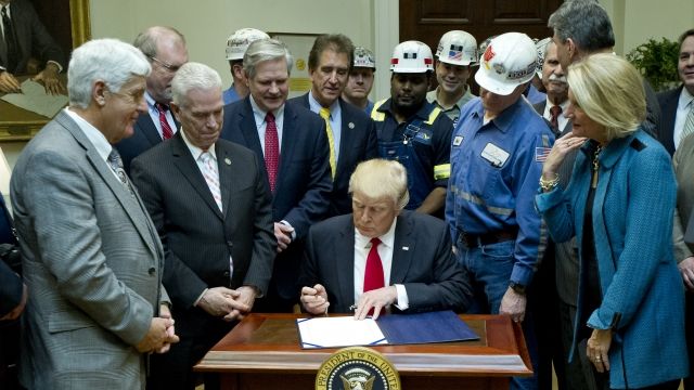 President Trump signs a joint resolution.