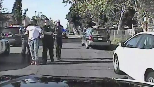 Sacramento police officers take a man into custody.