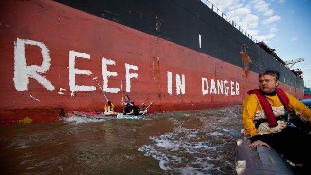 Activists painted the message "Reef in danger" on the side of coal ship in Australia.