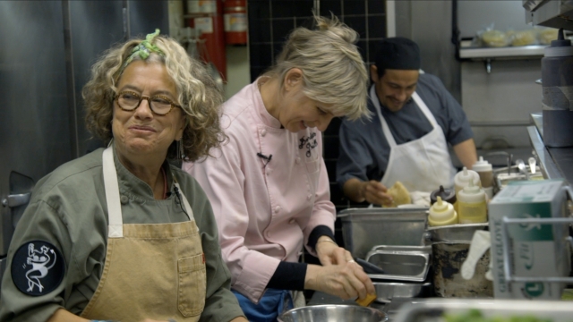 Susan Feniger and Mary Sue Milliken prepare a dish