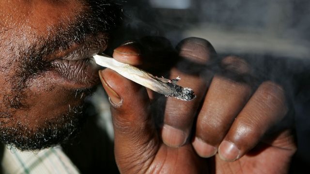 A man smokes medicinal marijuana.