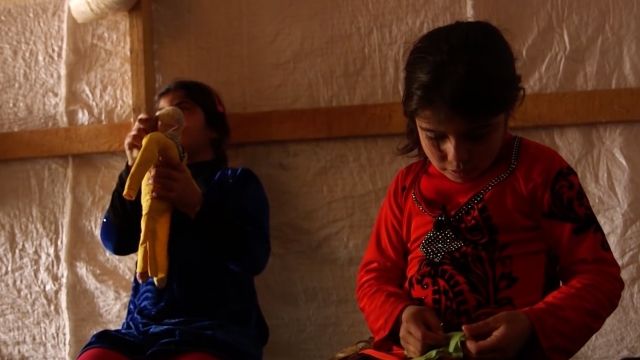 Two sisters from Syria make rag dolls
