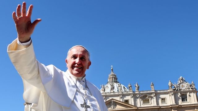 Pope Francis waves as he leaves St. Peter's Square.