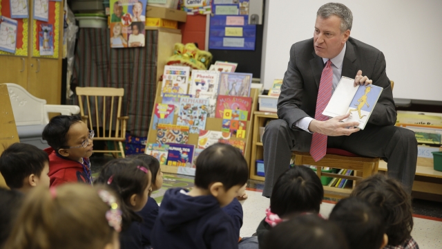 New York City Mayor Bill de Blasio reads to children in a pre-kindergarten class.