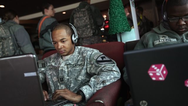 U.S. Army member works on a laptop