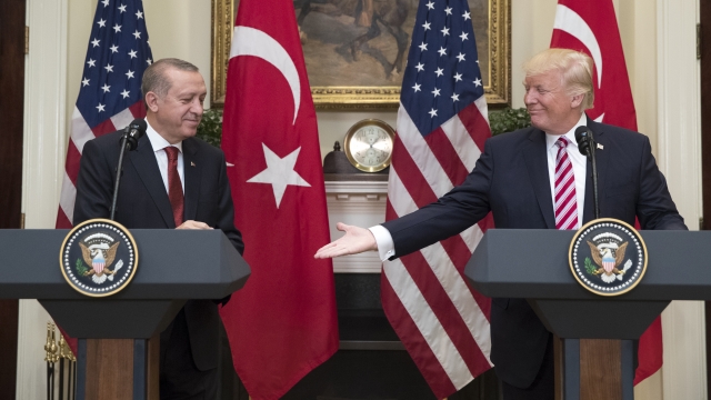 President Trump extends his hand for a handshake with President of Turkey Recep Tayyip Erdogan.