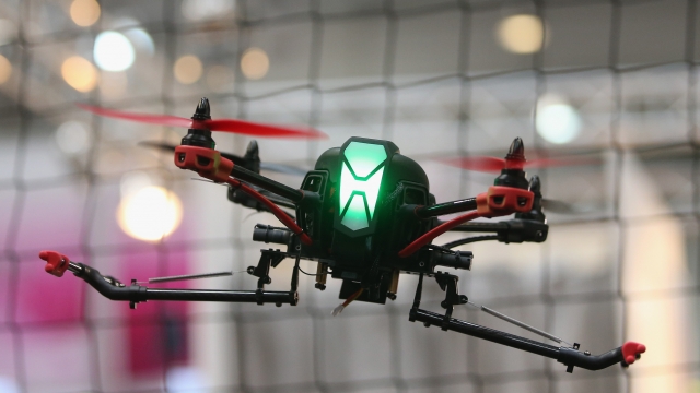 A multirotor drone flying at a trade fair