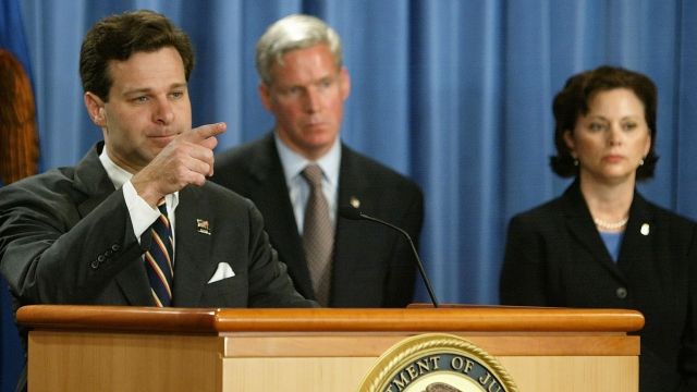 Former Assistant U.S. Attorney General Christopher Wray speaks at a podium.