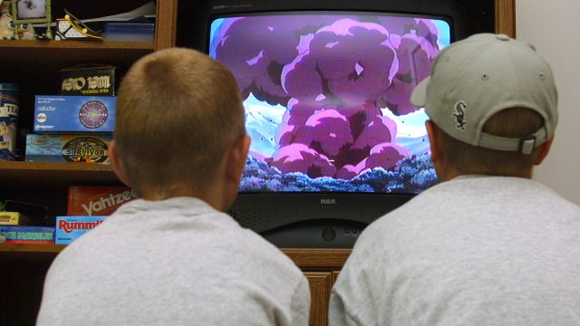 Kids watch a TV in Des Plaines, Illinois