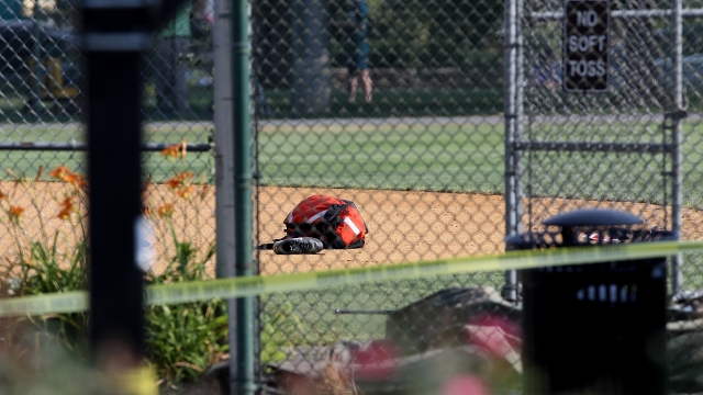 Crime scene tape surrounds a baseball field