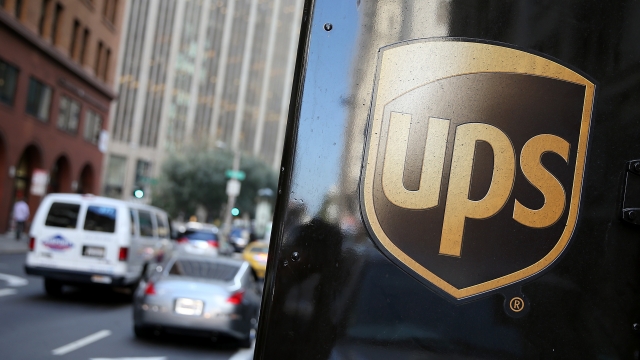 A UPS logo is displayed on a delivery truck.