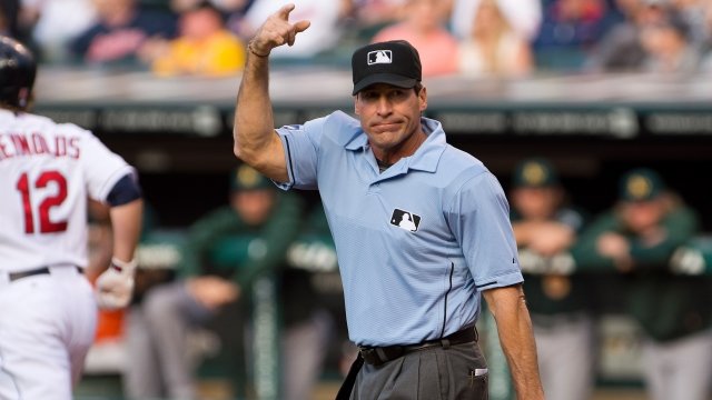 MLB umpire Angel Hernandez signals.