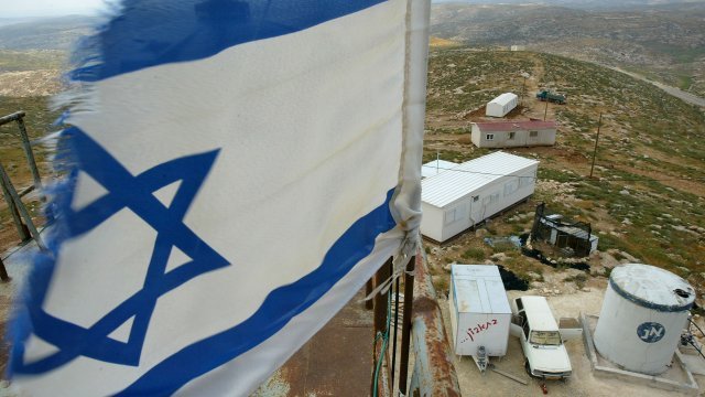 An Israeli flag flies at an outpost near Hebron.