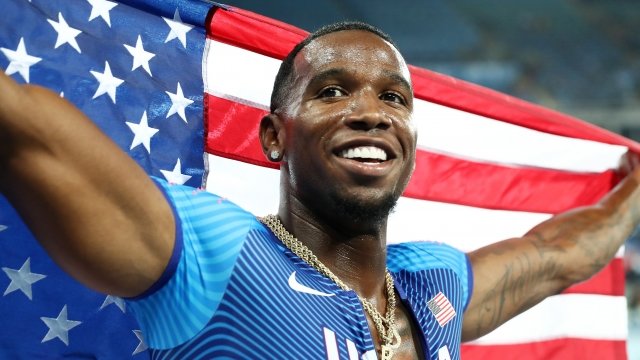 Gil Roberts of the United States celebrates after winning a gold medal.