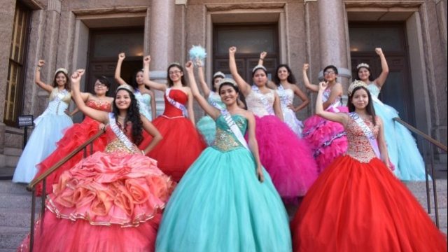 Quinceañera teens protest in front of the Texas Capitol building.