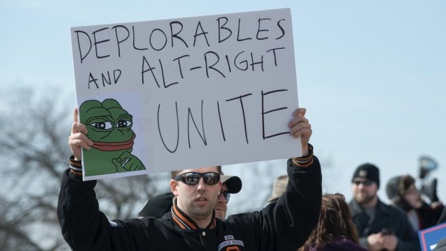 An "alt-right" supporter holds up a protest sign
