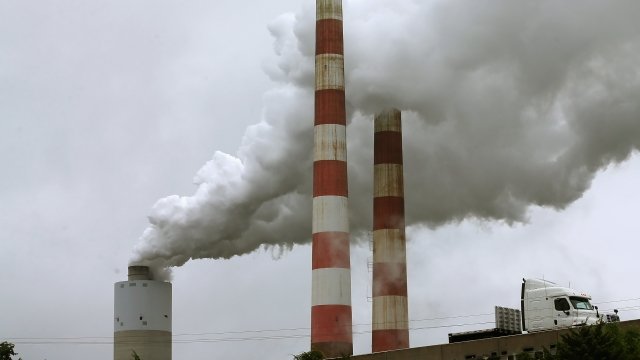 Emissions spew out of a large stack at the coal fired Morgantown Generating Station, on May 29, 2014.