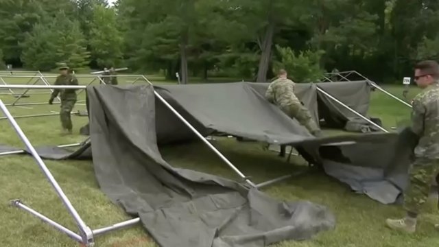Canadian soldiers build a tent village to temporarily house asylum seekers at the border.