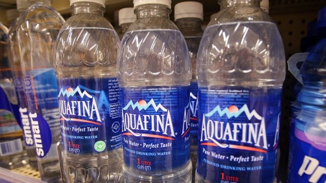 Aquafina water bottles on a shelf