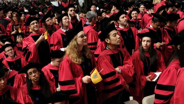Harvard University students attend commencement ceremonies.