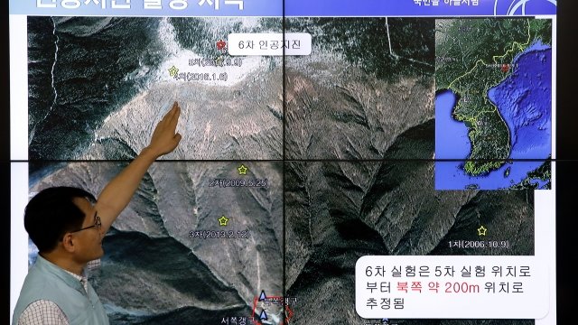Man points to Mount Mantap area nuclear site
