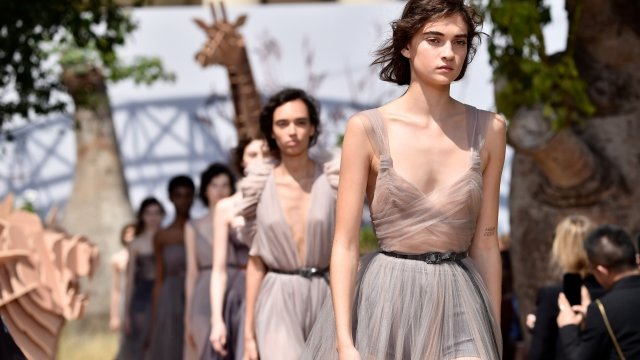 Models walk the runway for a Dior fashion show