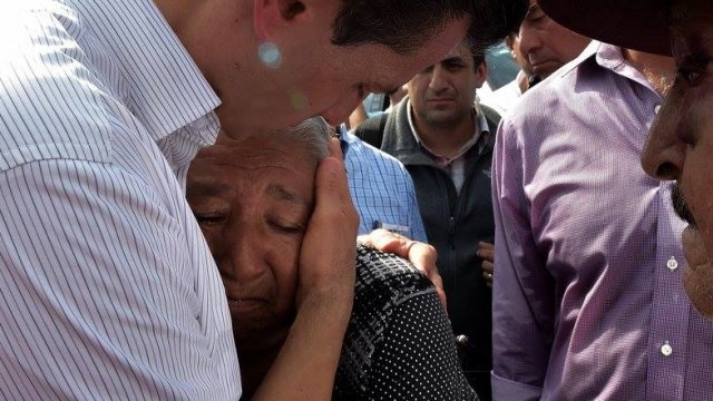 Mexican President Enrique Peña Nieto hugs earthquake survivor