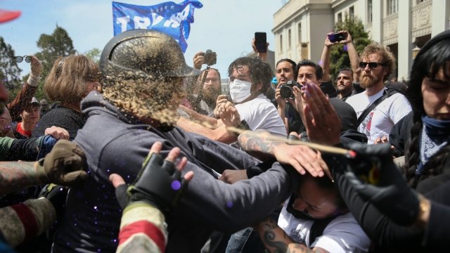 Trump supporters are pepper sprayed during a clash with protesters at a rally in Berkeley.